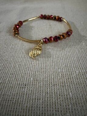 Gold Tone Bracelet with Red and Copper Beads and Leaf Charm